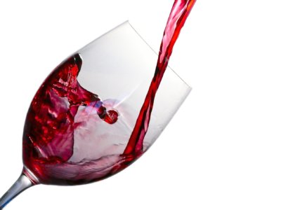 Red wine splashing into wine glass
