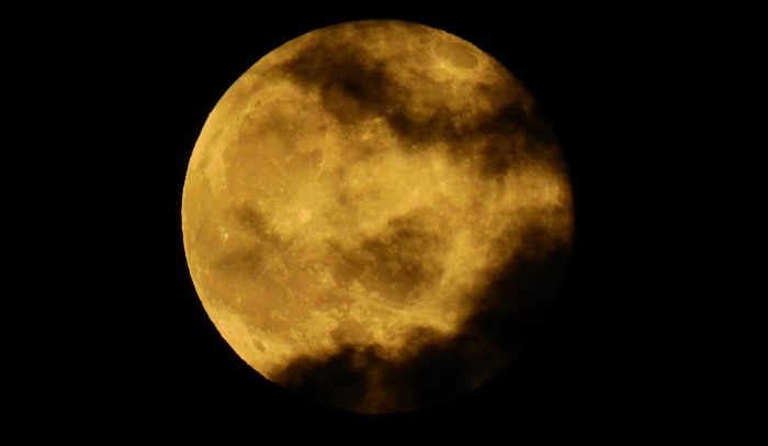 Yellow-tinged full moon