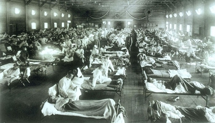 Historical photo of the 1918 Spanish influenza ward at Camp Funston, Kansas, showing the many patients ill with the flu. (US Army)