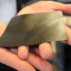 Thin gray sheet of graphene held in a hand