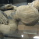 Image of upper body of tightly wrapped mummy